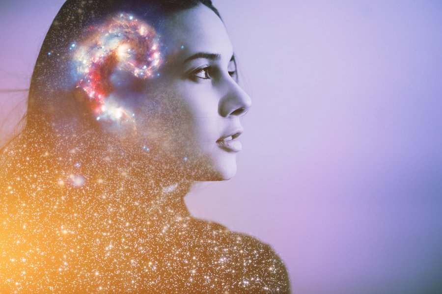 Double multiply exposure abstract portrait of a dreamy cute young woman face with galaxy universe space inside head. Human spirit, astronomy, life zen concept Elements of this image furnished by NASA