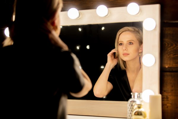 beautiful blonde woman near makeup mirror 2022 01 11 03 58 48 utc